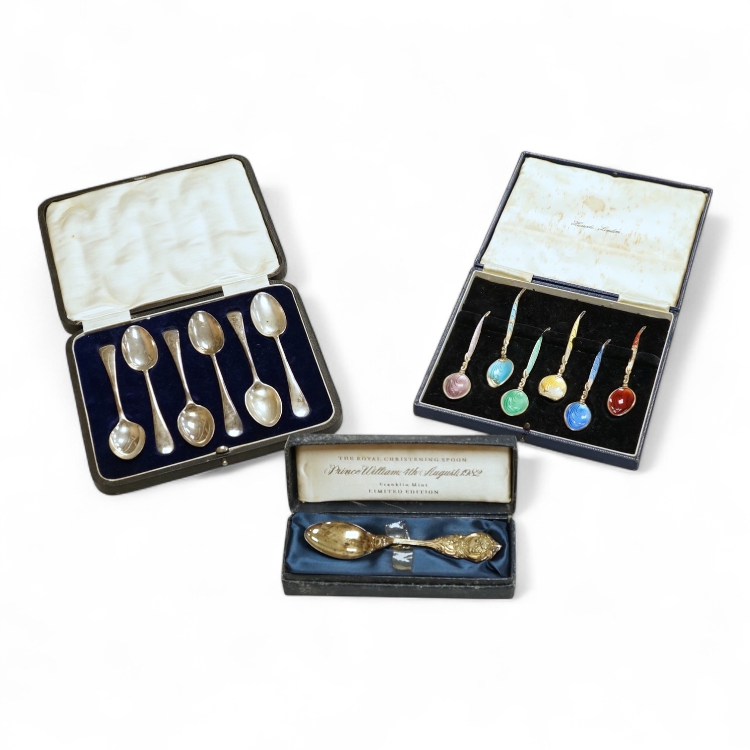 A cased set of six George VI silver teaspoons, James Dixon & Sons, Sheffield, 1948, a cased set of six silver and polychrome enamel coffee spoons and a cased single silver spoon.